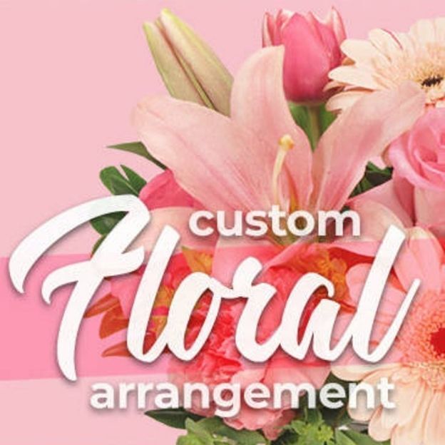 Custom floral arrangement text over pink background with lilies, roses, and gerbera daisies.